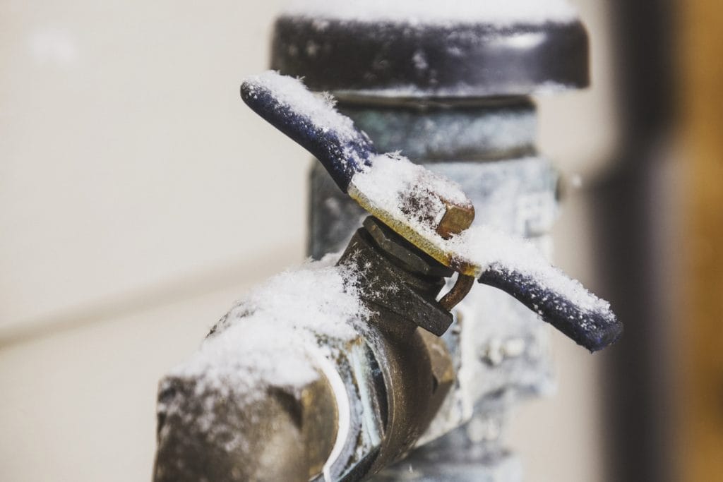 Frozen water shut off handle in snowstorm
