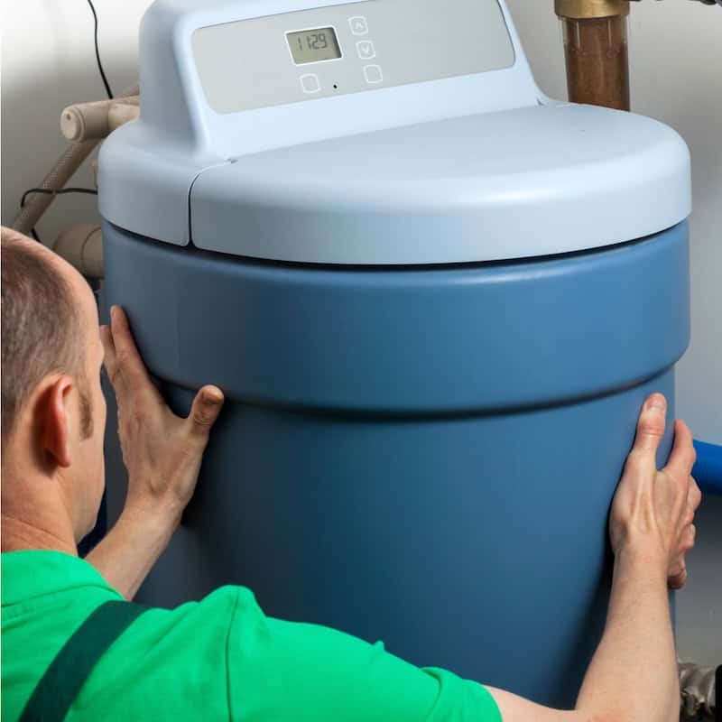Man Inspecting Water Softener
