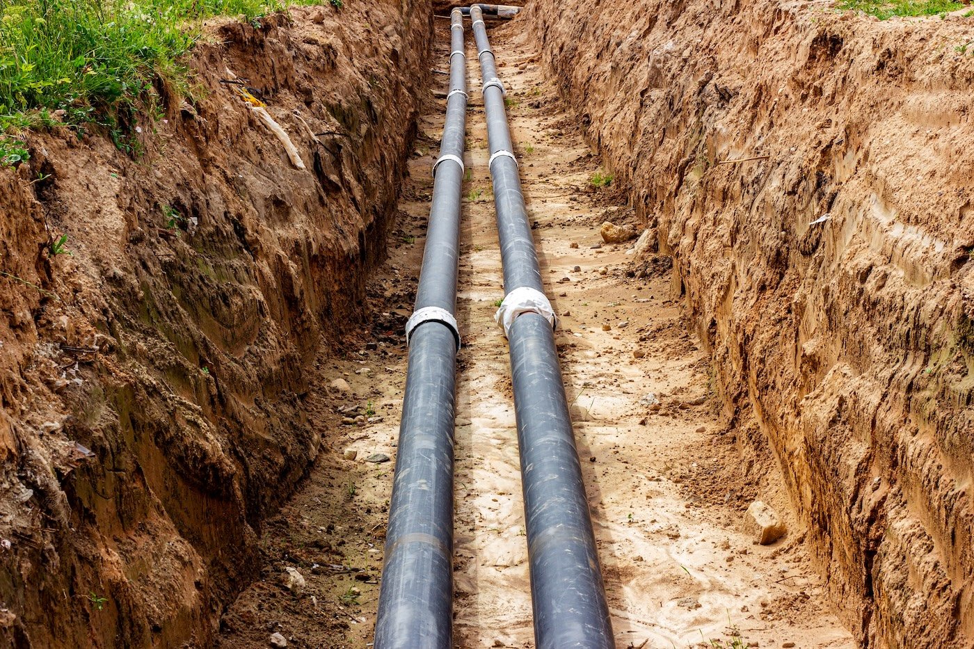 Installation Of The Distribution Unit Of Heating And Water Supply Network. Frame For Connecting Pipes In The Trench Of Ground