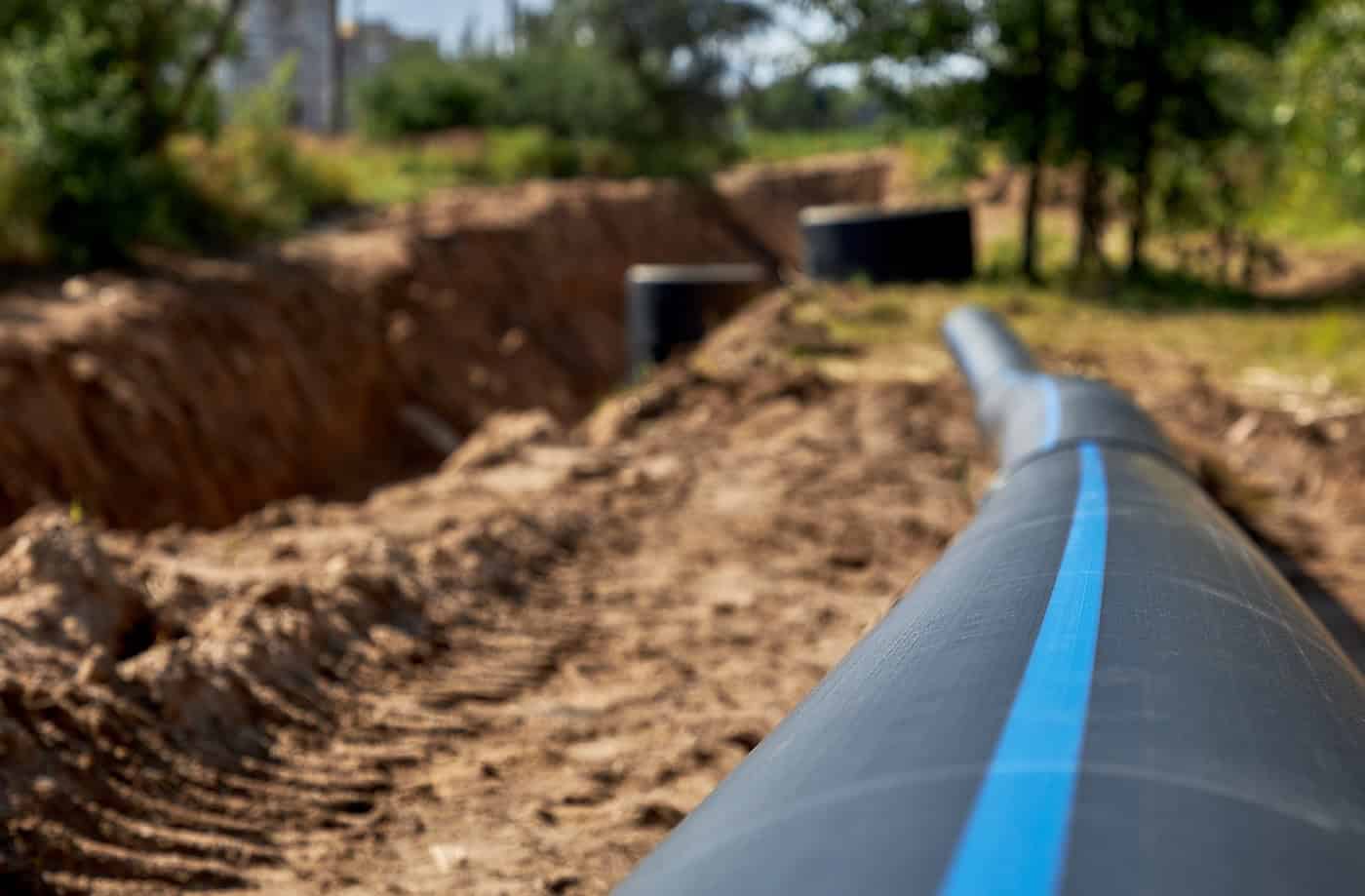 Close Up Of A Large Industrial Plastic Polypropylene Water Pipe At A Construction Site For Laying Water Pipes, Construction And Reconstruction Of Buildings And Cottages.