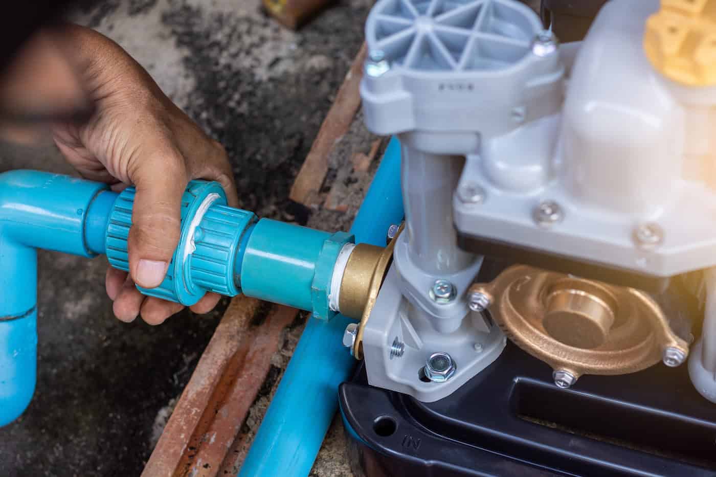Joint To Blue Plastic Pvc Water Pipe Line At Water Pump Machine. Maintenance Concept.