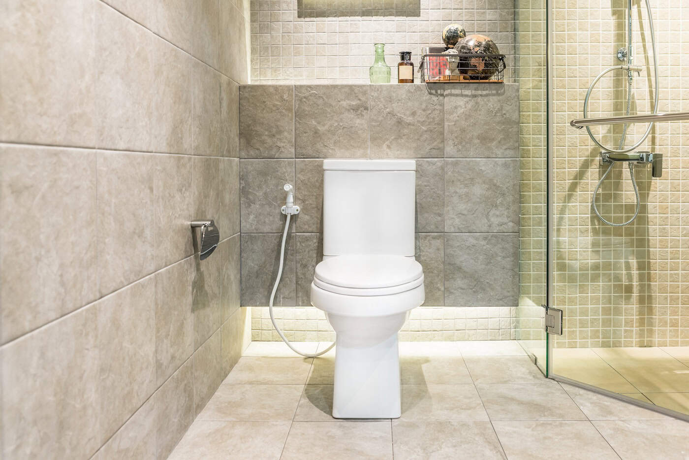 White Toilet Bowl In Modern Bathroom At Hotel. Interior Of Toilet In Bathroom.