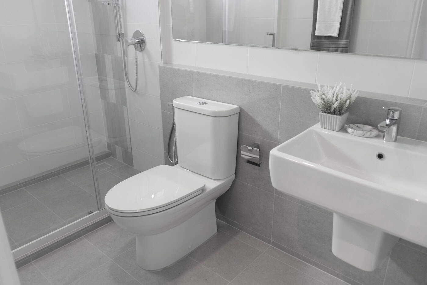 Clean Bathroom With Toilet And Sink In Modern House.