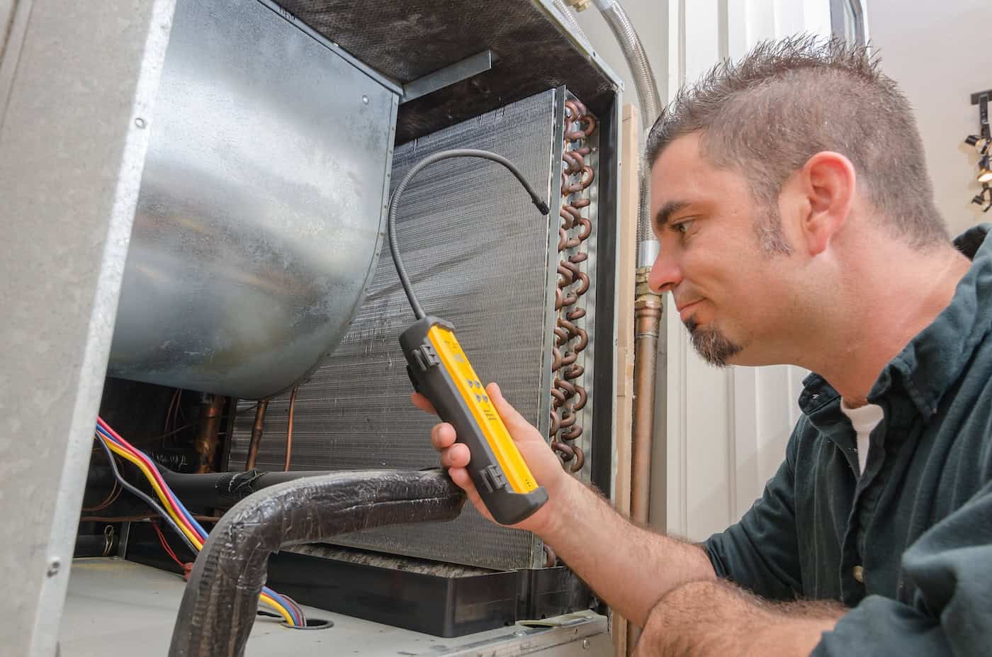 Hvac Technician With Leak Detector