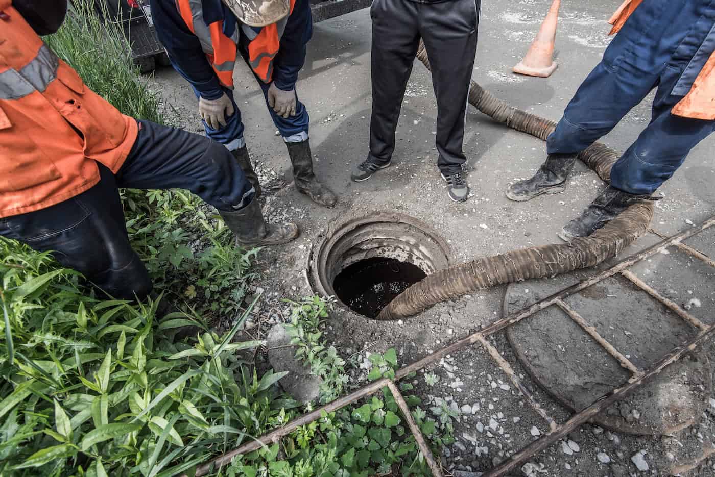Sewerage Accident. Workers Pump Water.