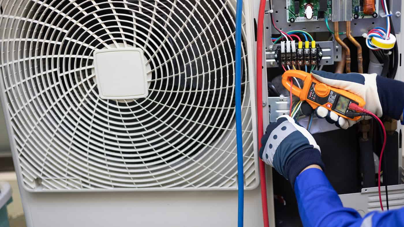 Close Up Air Conditioner's Technician Hand Check  Electrical Circuit And Maintenance Condensor Unit, Home Care Service