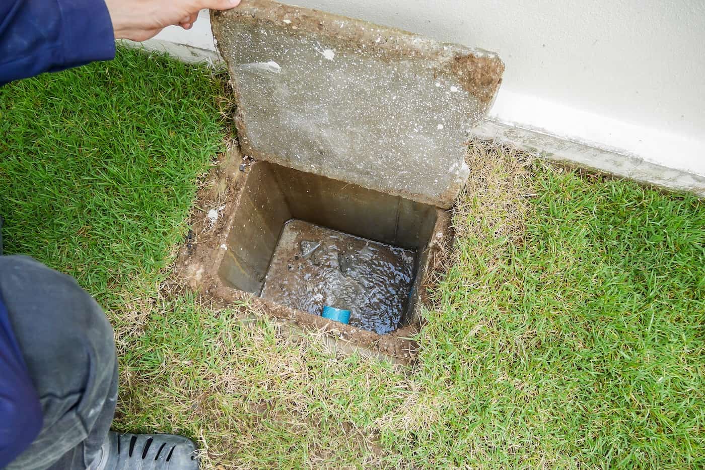 Worker Hand Open Sewer Of New House