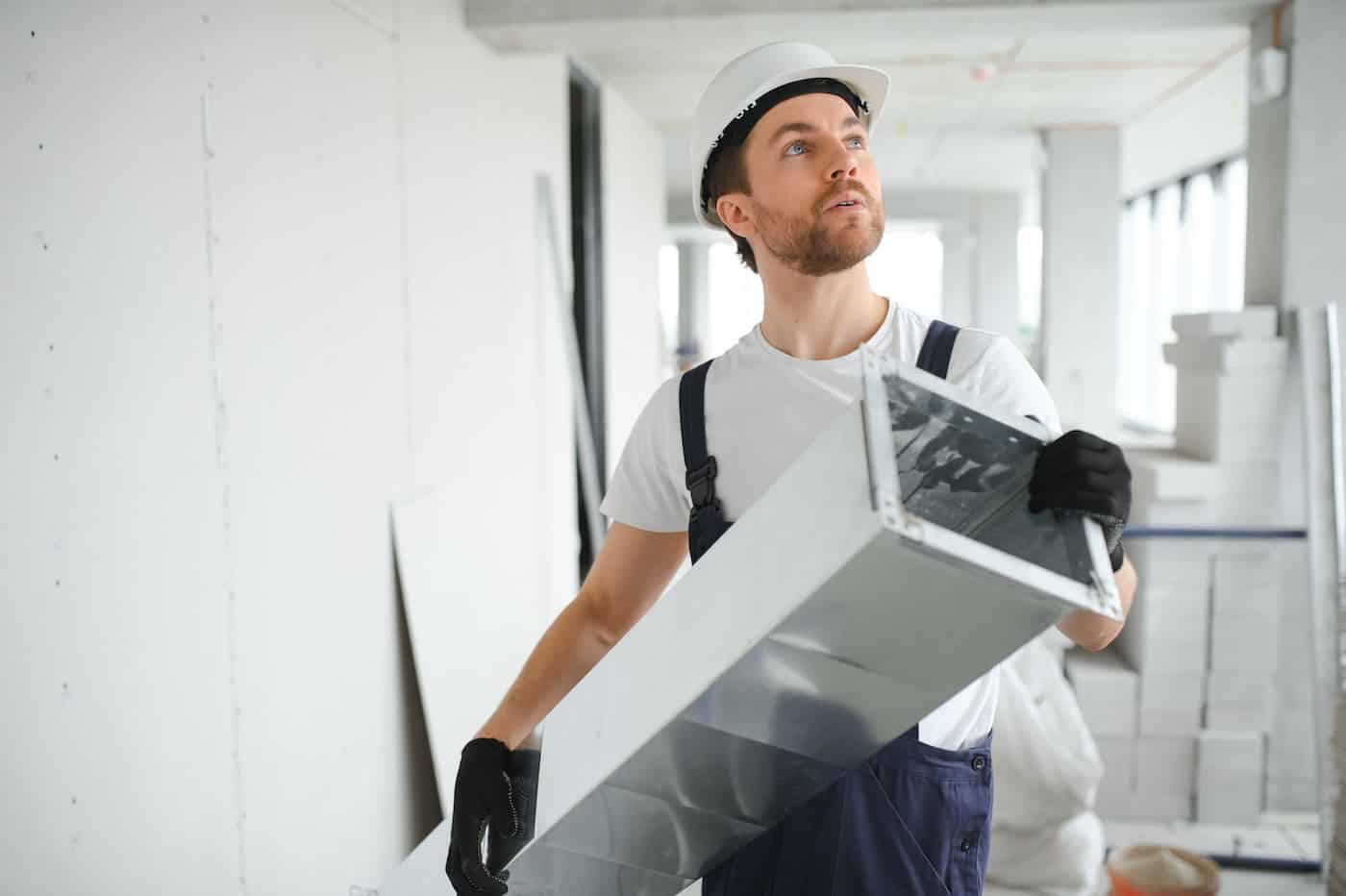 Hvac Services   Worker Install Ducted Pipe System For Ventilation And Air Conditioning