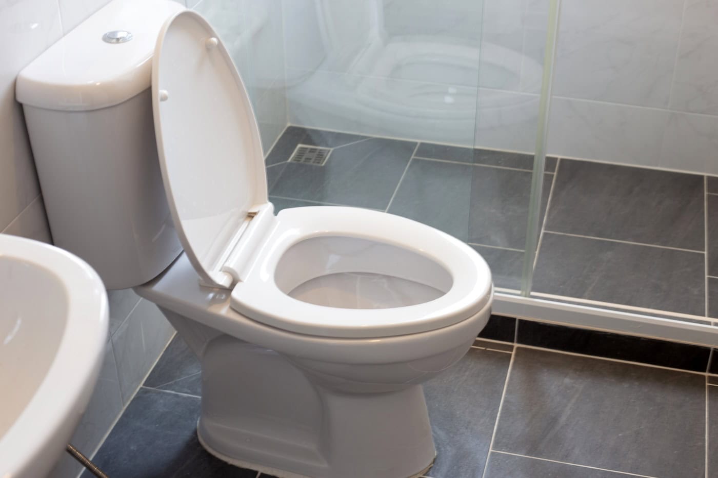 White Toilet Bowl On Floor