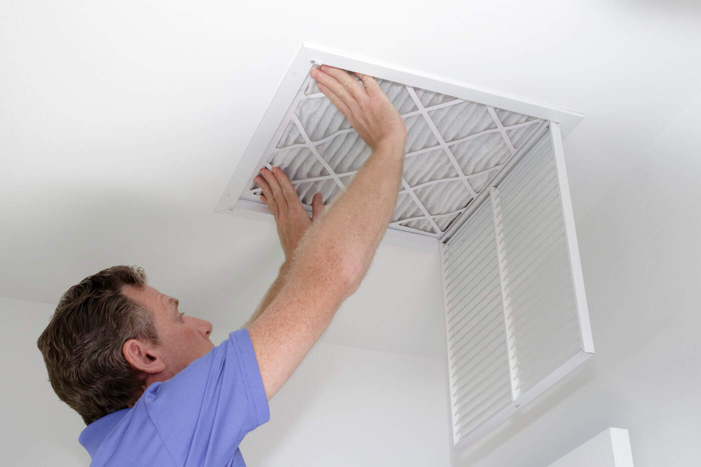 Inserting New Air Filter In Ceiling