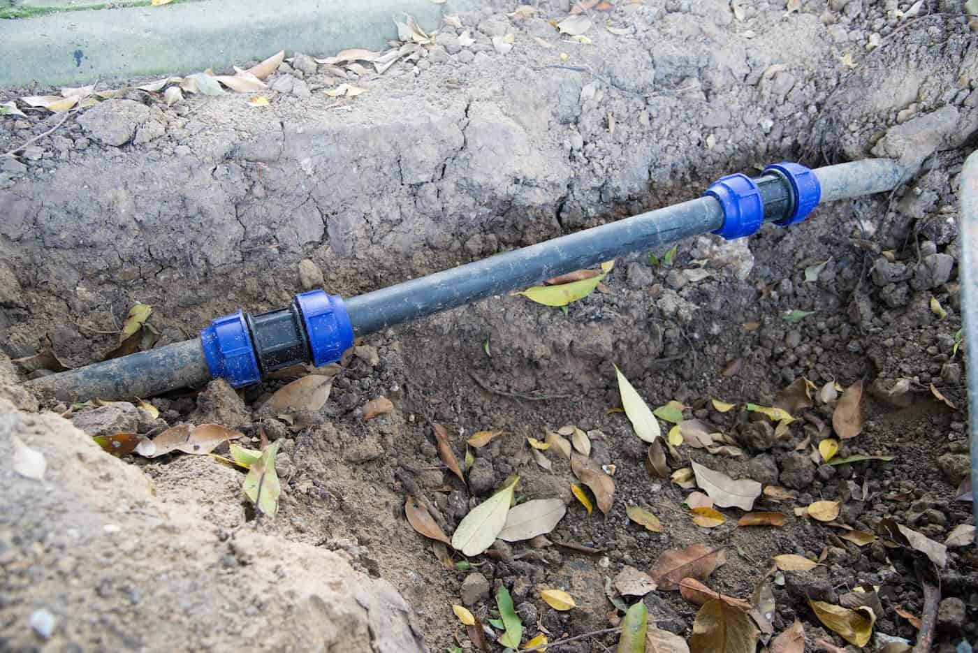 Water Pvc Plastic Pipes In Ground During Plumbing Construction Site.