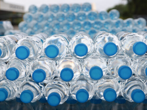 Stack of single use plastic water bottles
