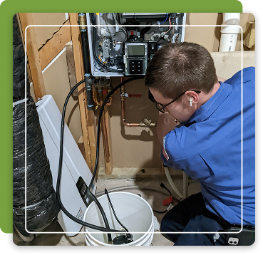 person fixing tankless water heater