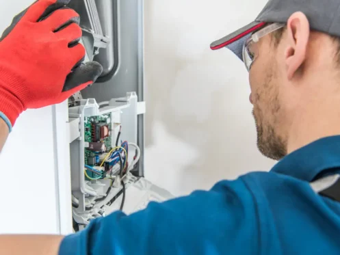 Furnace being fixed by a technician