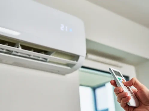 homeowner-using-ac-remote