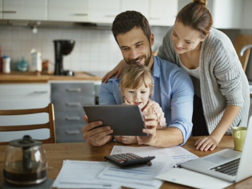 Family budgeting ac installation costs on laptop
