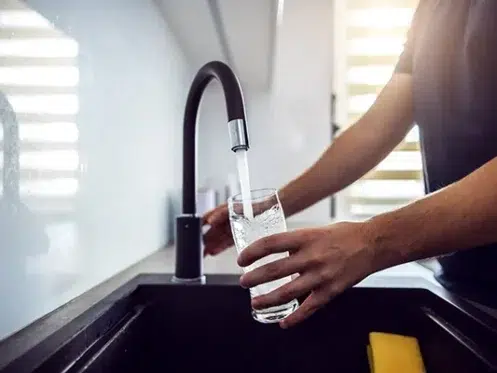 man-pouring-fresh-water