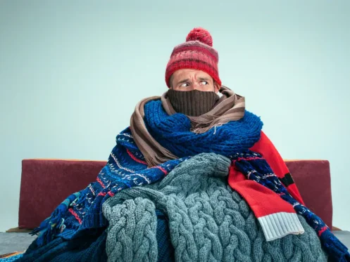 man-trying-to-warm-up-at-home
