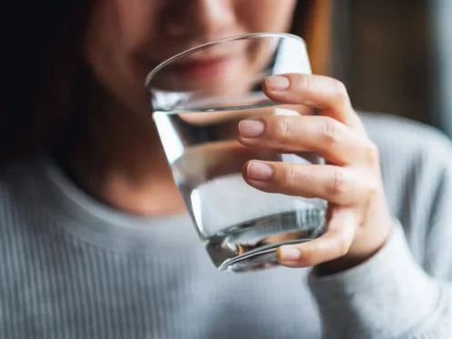 Woman drinking clean drinking water