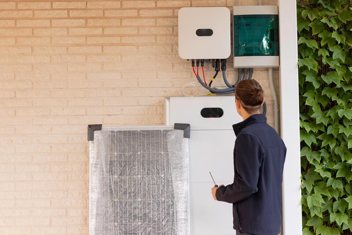 worker-looking-at-home-generator
